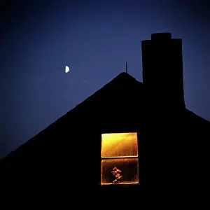 Ger002: House Silhouetted Against Half Moon Night Sky