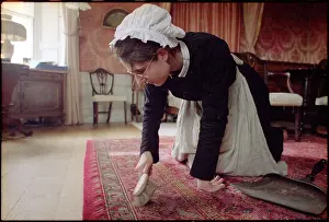 Knees: HOUSEMAID BRUSHES CARPET