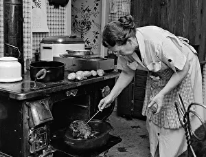 Hanukkah: Housewife Testing Roast Beef in Oven to See If It is Done Co