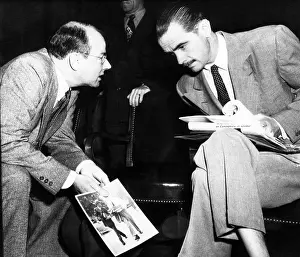 Slack: Howard Hughes (right) confers with his counsel, ?