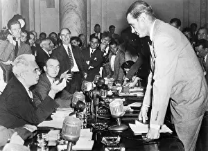 Subcommittee: Howard Hughes (right) confers with Senator ?