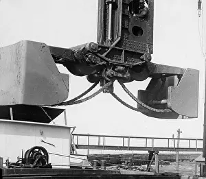 Steelworks: A Hughlett clam-shell hoist unloading a ship's