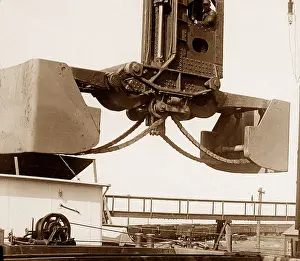 Steelworks: A Hughlett clam-shell hoist unloading a ship's