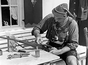 Mauser: Hunter cleaning the weapon, 1930s