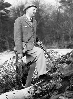 Tweedy: Hunter with game and shotgun
