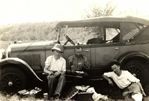 Tourer: Hunting party have a picnic by their car