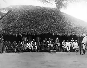 Africans: In front of the hut of a village elder in German