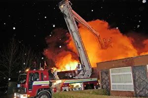 Carshalton: Hydraulic platform at work on fire at commercial premises