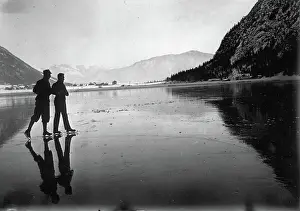 Achensee: This ice skaters are relfected in