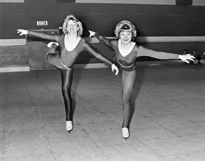 Two ice skaters in a skating rink, Cornwall