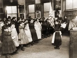 Assimilation: Immigrant children saluting the flag in ?