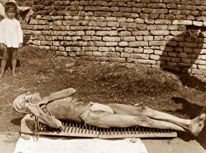 Spikes: India - Calcutta - doing penance on a bed of spikes