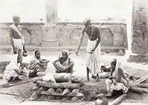 Cremation: India - women preparing a corpse for cremation, Calcutta