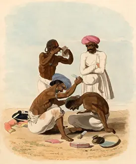 Client: Indian barber. In the foreground a barber is shaving
