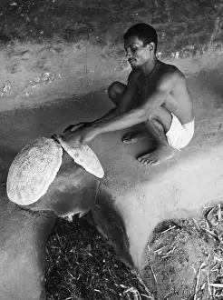 Mahout: Indian mahout baking a flatbread