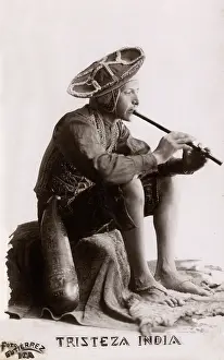 Woodwind: Indian man playing the flute, India