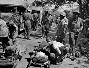 Ambulance: Indian medical orderlies assisting with wounded