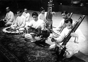 Sitar: An Indian music ensemble playing various musical instruments