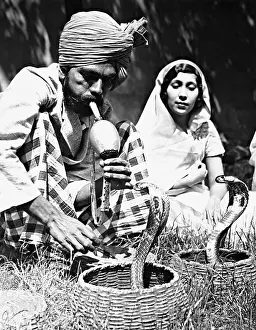 Charmer: Indian snake charmer, 1938