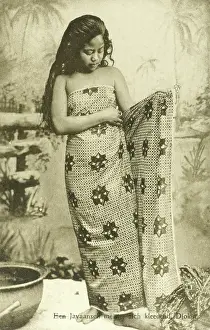 Javanese: Indonesia - Java - Young girl puts on sarong