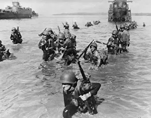 Hopping: Infantrymen wade ashore in neck-deep water from