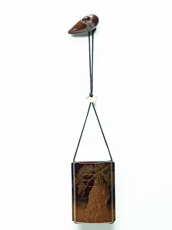 Ojime: Inro with bird of prey, attached to a bird-shaped netsuke