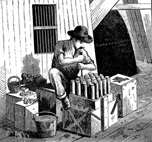 Smaller: Inserting detonators into cartridges of dynamite