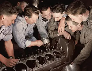Instructor: Instructor showing a group of men how to assemble