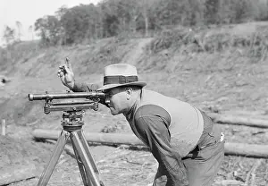 Accuracy: Instrument man working on new construction