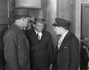 Fedora: Interaction between serious man and teenage boy
