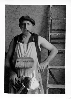 Decorators: Interior Decorator with his brushes, ladder and pipe!