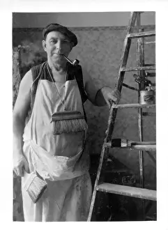 Decorators: Interior Decorator with his brushes, ladder and pipe!