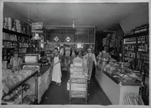 Errands: Interior of a grocery store, with six employees