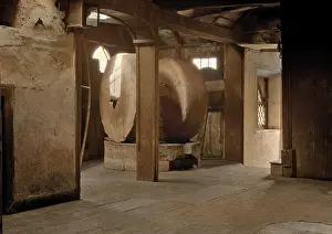 Millstone: Interior of a mill with two millstones