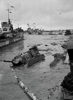 Wreck: Some invasion craft and a tank submerged