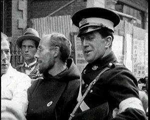An Irish Priest Talking To A Soldier in a Car