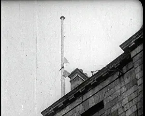 Tricolore: Irish Tricolore Being Raised Above A Building In Dublin