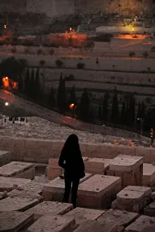 Pray: Israel. Jerusalem. Mount of Olives. Jewish Cemetery. Woman p