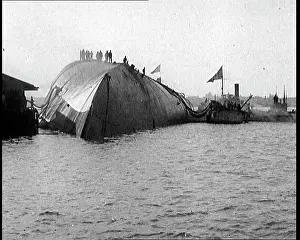 Capsized: Italian Sailors Standing on the Underside Of
