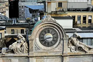 Decorate: Italy. Milan. Clock decorated with two statues