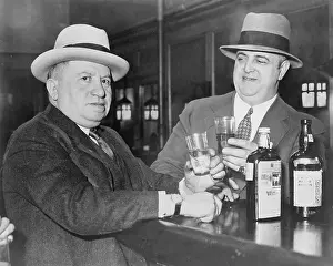 Confiscate: Izzy Einstein (left) sharing a toast with ?
