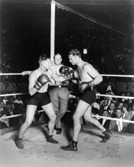 Bare Chested: Jack Dempsey boxing with his trainer and sparring