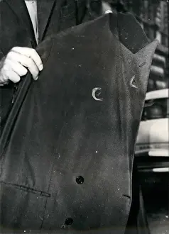 Volley: Jacket of Jacques Soustelle with burn marks from bullets