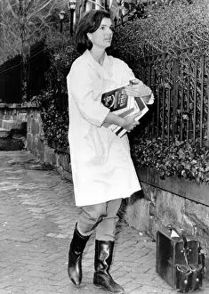 Armful: Jacqueline Kennedy, moving into her new ?
