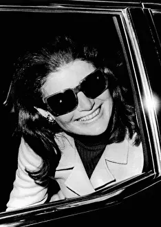 Limousines: Jacqueline Kennedy Onassis smiles as she ?
