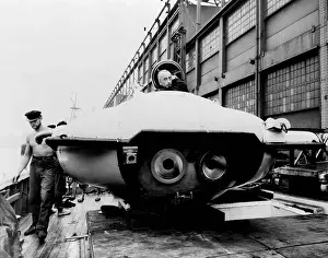 Calypso: Jacques Cousteau, peering out a two-man ?