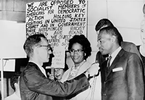 Segregationist: James Meredith and wife in front of segregationist ?