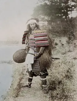 Samurai: Japanese actoras a samurai, armour, two swords, grass coat