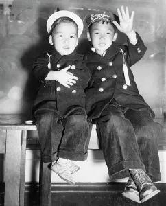 Old Fashion: Two Japanese-American boys wait for a bus