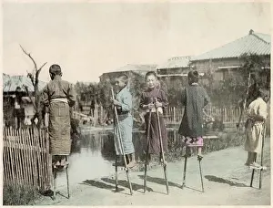 Bamboo: Japanese boys playing on bamboo stilts